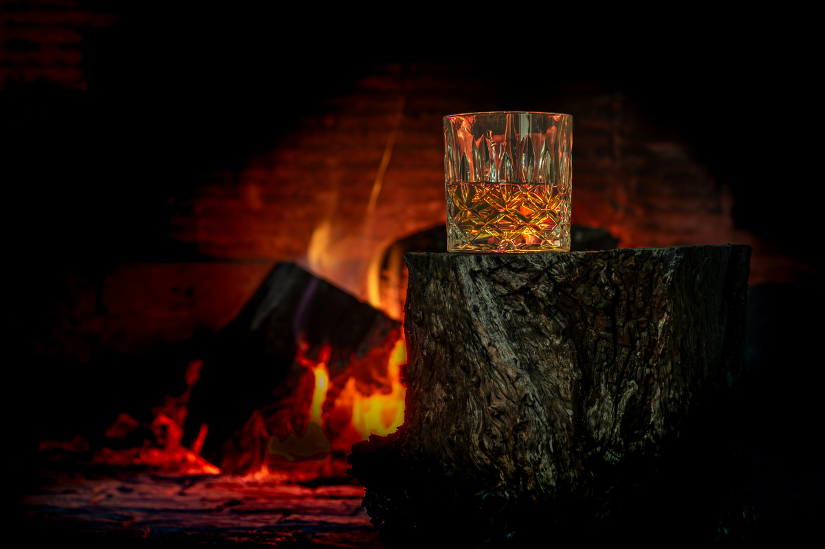 The image chosen to represent: Bourbon & Firelight: An Evening Under the Stars